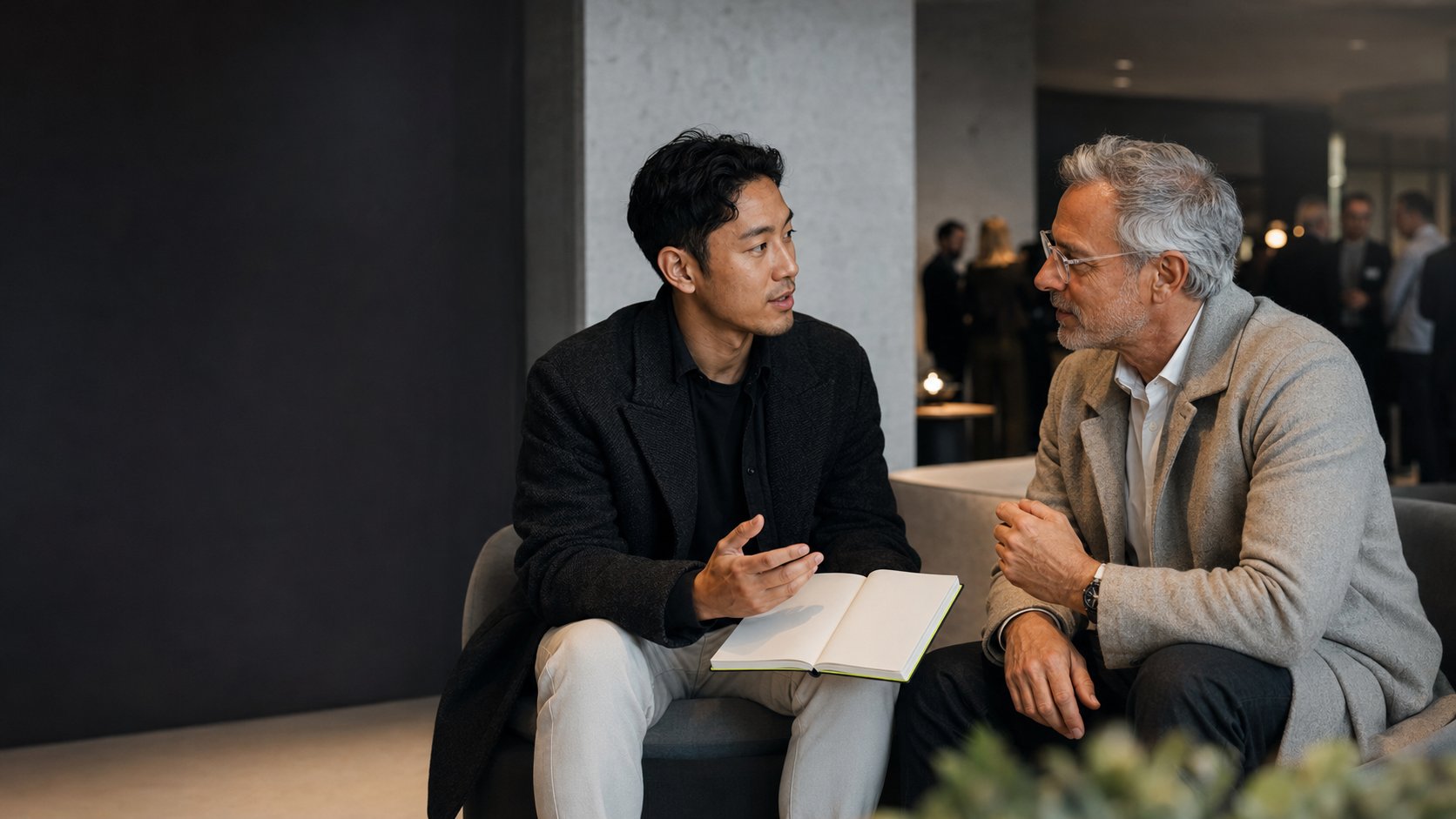 Two founders in a focused one-to-one conversation